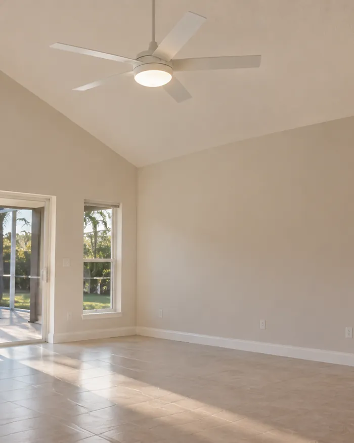 New white ceiling fan on a vaulted living room ceiling